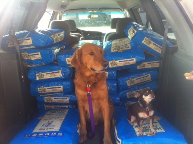 Sam and Sophie from Friends with Four Paws rescue loading up their truck with food from the Rescue Bank's distribution in Oklahoma. This group rescued 323 dogs last year!
