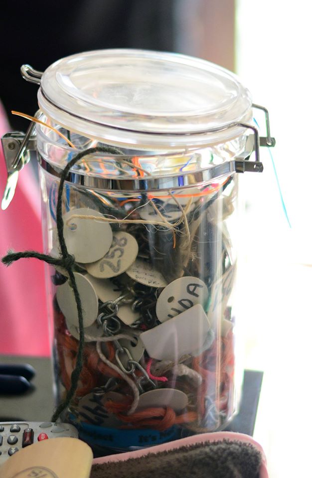 Jar of tags from rescued dogs. Image source: Shannon Williams)