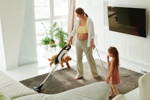Vacuuming near dog
