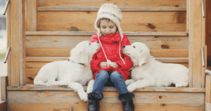 Child with Puppies