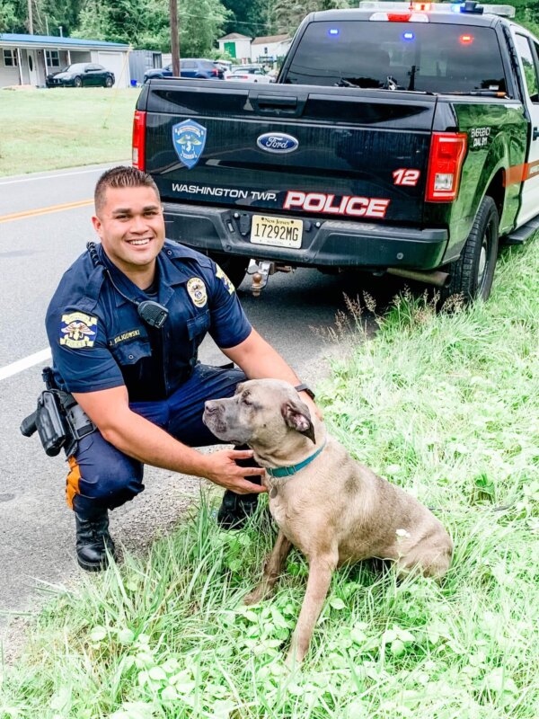 Officer with Rescued Dog