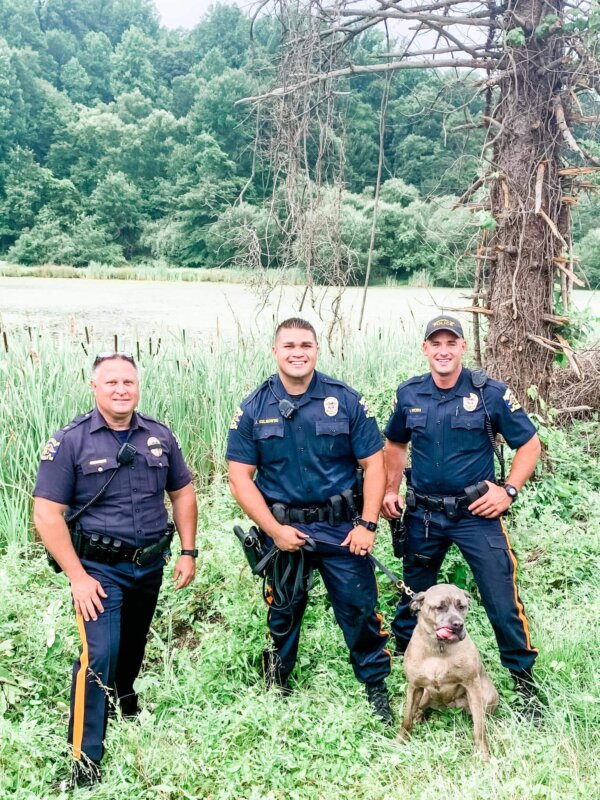 Officers with rescued dog