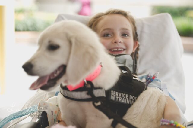 Girl Hugging Service Dog