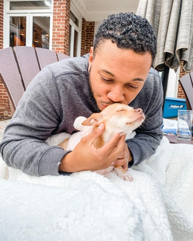 Man kissing Chihuahua