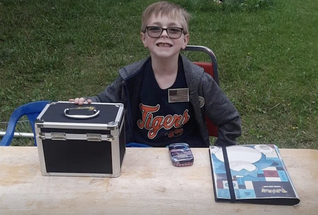 Boy selling Pokemon cards