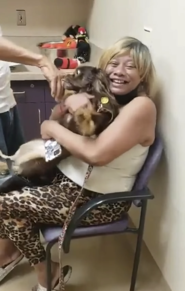 Woman hugs lost dog