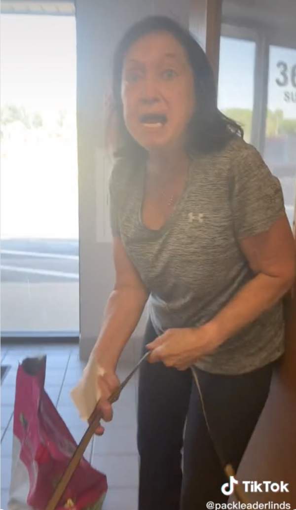 Woman yells at dog trainer