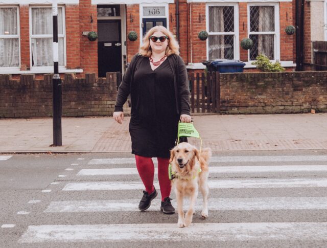 Woman walking guide dog