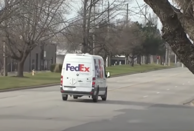 FedEx truck driving away