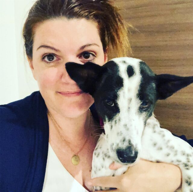 Woman holds rescue dog