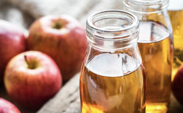Apples next to apple cider vinegar