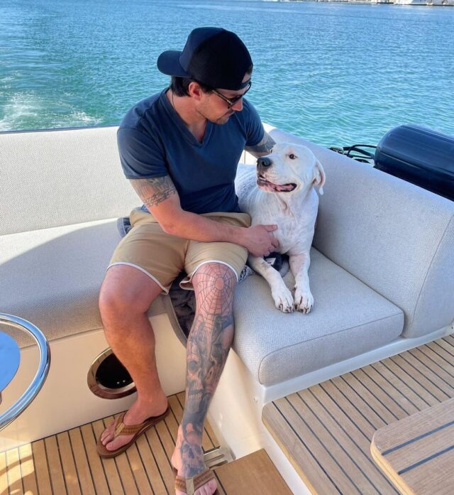 Josh Hall Boating with dog