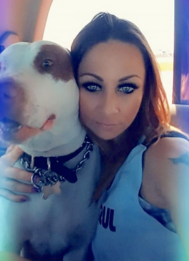 Woman with late Pit Bull