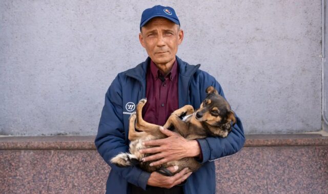 Man and dog cross Ukraine