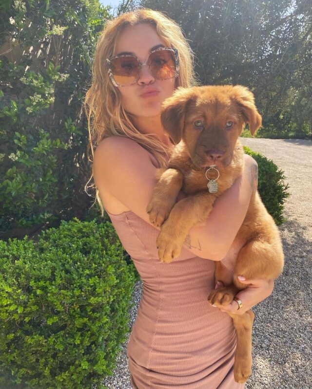 Rita Ora holding puppy