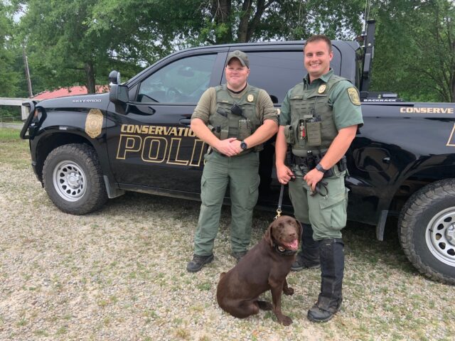 Conservation police with dog