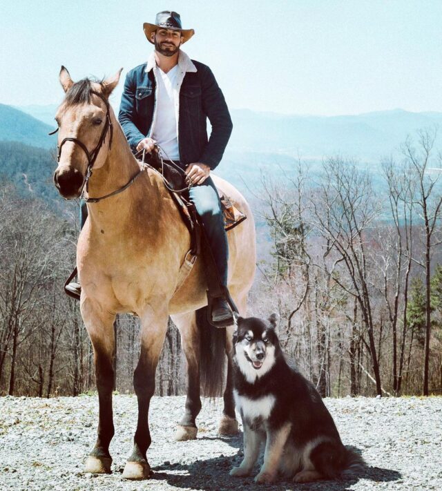 Man horse and dog posing