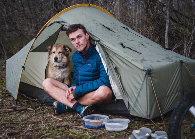 Man and dog in tent