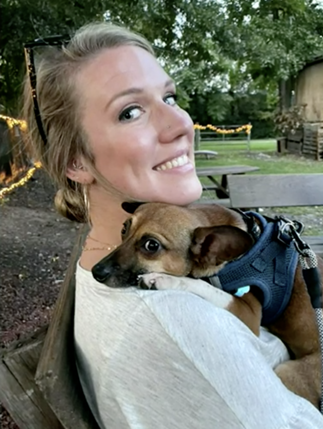 Woman comforting Chihuahua