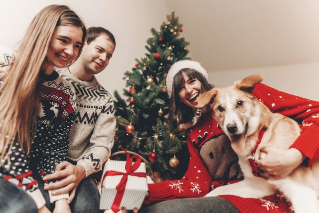Family with dog excited about presents