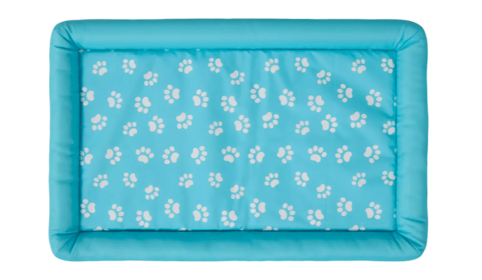 An aqual blue bolstered cooling mat with white paw prints for dogs from PetSmart