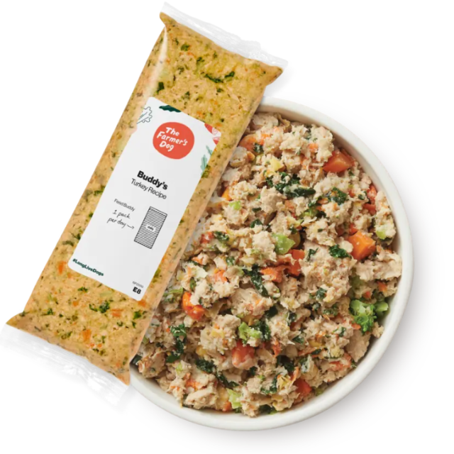 A packet and bowl of The Farmer's Dog fresh dog food.