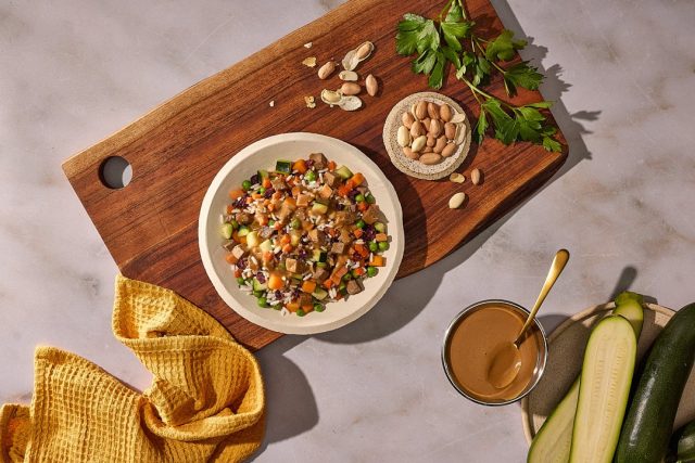 Golden Child Beef & Veggies bowl topped with Peanut Butter Drizzle satay