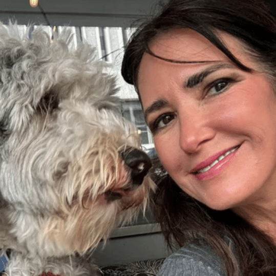 Founder Carol Brymm with Valentino, her Sheepadoodle