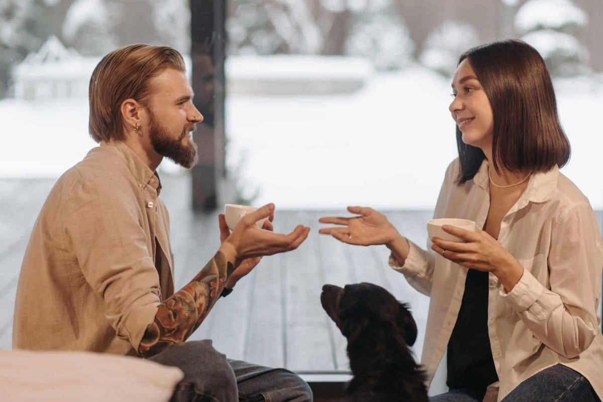 An expressive dog appearing eager to participate in every family conversation.